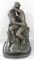 A bronze sculpture of “The Kiss” after Rodin, raised on a marble plinth, 40cm high x 25cm wide.