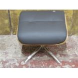 A contemporary chrome and leather Eames style footstool