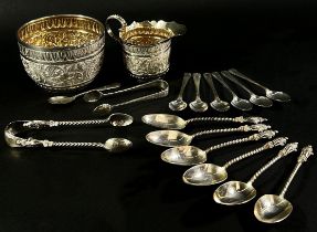 A selection of silver to include a christening set, teaspoons, six Apostle spoons, a sugar tong fish