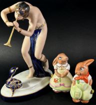 Royal Dux Snake Charmer figure, together with a pair of Royal Dux Bunny's