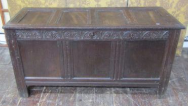Early 18th century oak panelled coffer with carved and moulded frieze work, 240 cm wide