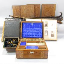 Four carved oak panels and five walking sticks, together carved timber chess set and two Victorian