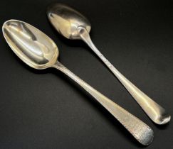 Four silver dinner spoons with different designs and makers, 8 ozs approximately