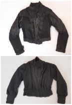 2 Victorian ladies fitted blouses, the first in black wool and silk satin with ruched yoke,