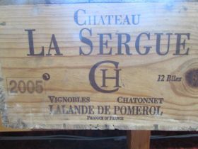 A wooden case of twelve bottles of 2005 Chateau La Sergue Lalande de Pomerol.