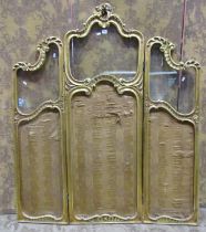 A decorative three fold gilded room divider partially glazed, the framework with C scroll and floral