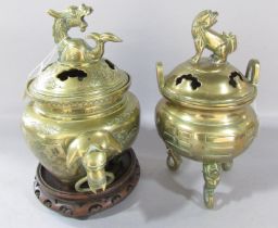 A Chinese bronze censer, with elephant head handles and dragon mounted cover and engraved birds