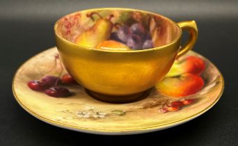 A signed miniature Worcester cabinet cup and saucer, decorated with fruit, signed 'Ricketts' (