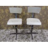 A pair of vintage swivel machinist/typist chairs with moulded plywood seats and backs