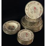 Minton Jasmine pattern dinnerware comprising twelve dinner plates, eleven side plates of two