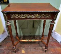 A decorative mahogany centre table raised on four turned and fluted supports with central stretcher,