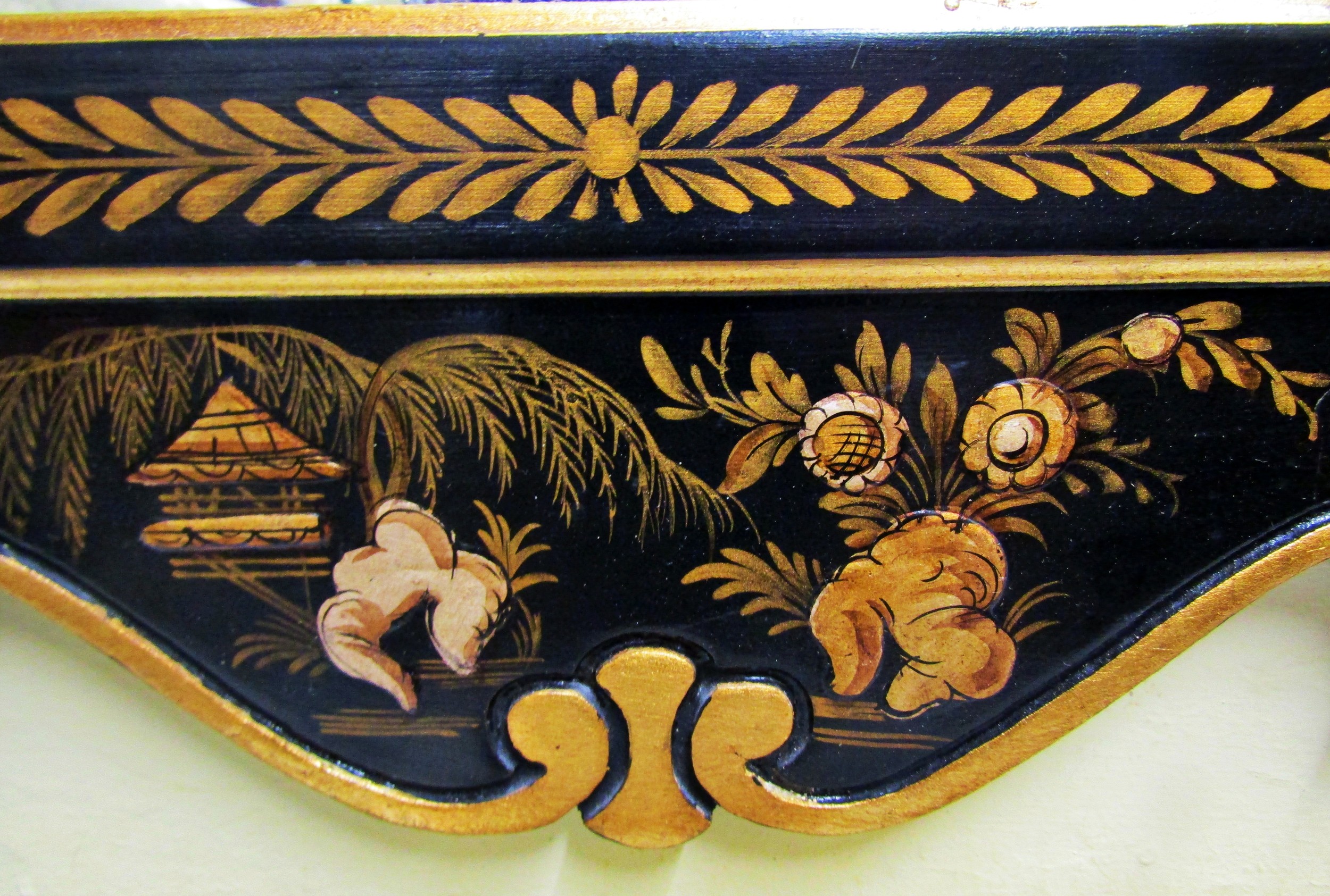 An 18th century style wall mirror with chinoiserie detail frame in black and gilt, set beneath a - Image 2 of 5