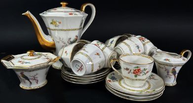 A Limoges porcelain coffee set decorated with exotic pheasants - 9 cups & 12 saucers, coffee pot,