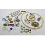 Mixed lot including a vintage 9ct watch, a silver thimble, a collection of loose gemstones to