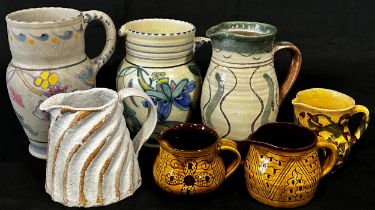 An interesting mixed collection of studio pottery and other jugs, by individual potters including