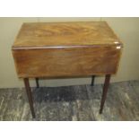 A Georgian mahogany Pembroke table with cross banded borders, on slender square cut supports, 72cm