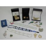 Mixed collection of costume jewellery to include a large Swarovski piano brooch and a pair of