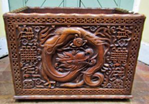A Chinese carved rectangular hardwood box, with dragon, cloud and other detail, within a geometric