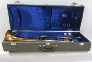 A Vintage Boosey & Hawkes brass trombone, with two mouth pieces in it’s original case.