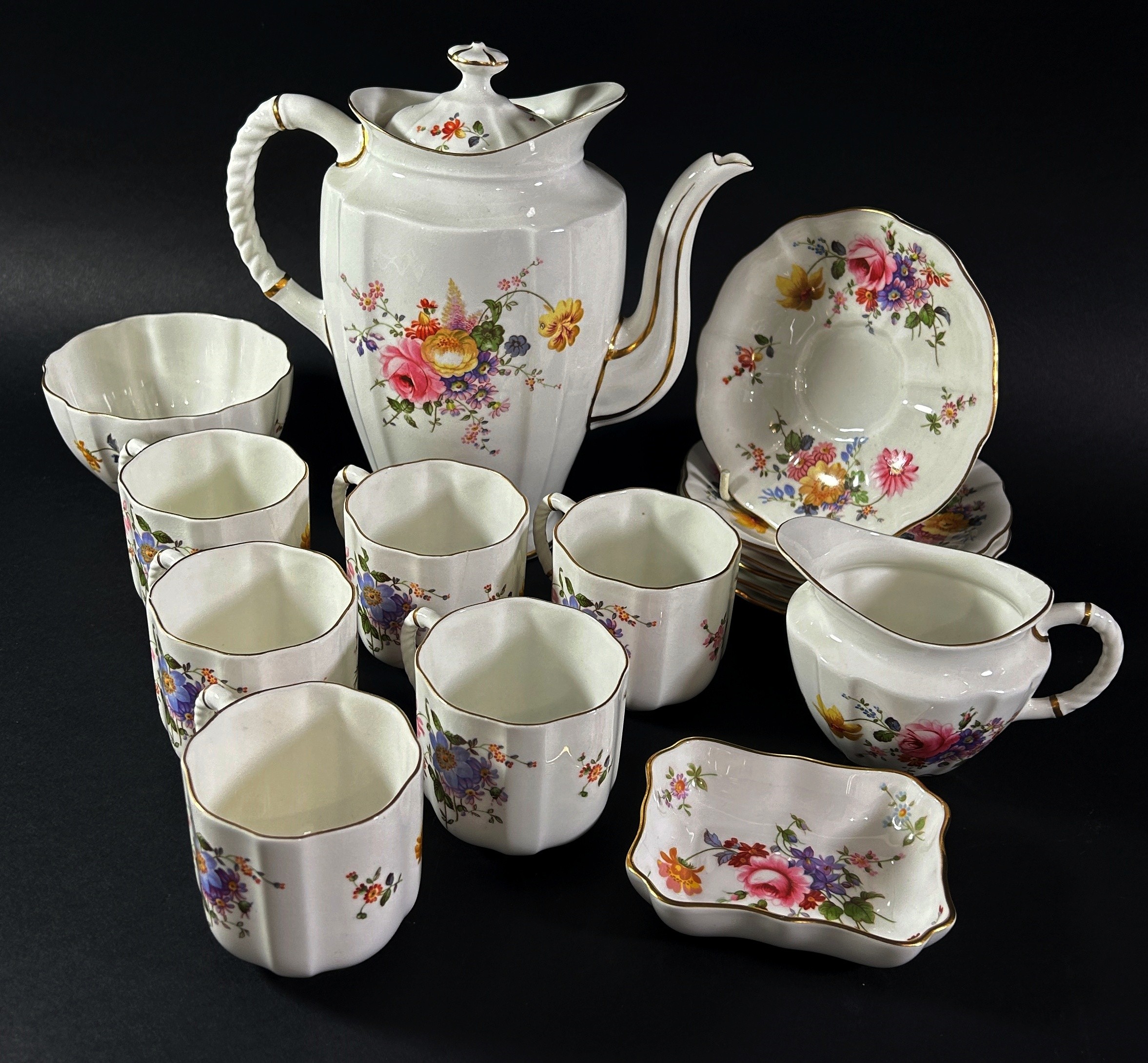 A Royal Crown Derby coffee set for six with floral bouquet details