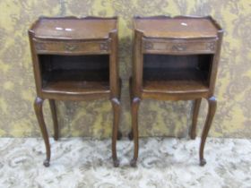 A pair of continental oak tray top bedside tables with shaped outline and scrolled cabriole supports
