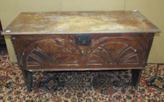 An 18th century elm six plank coffer, the front elevation with simple repeating geometric carving,