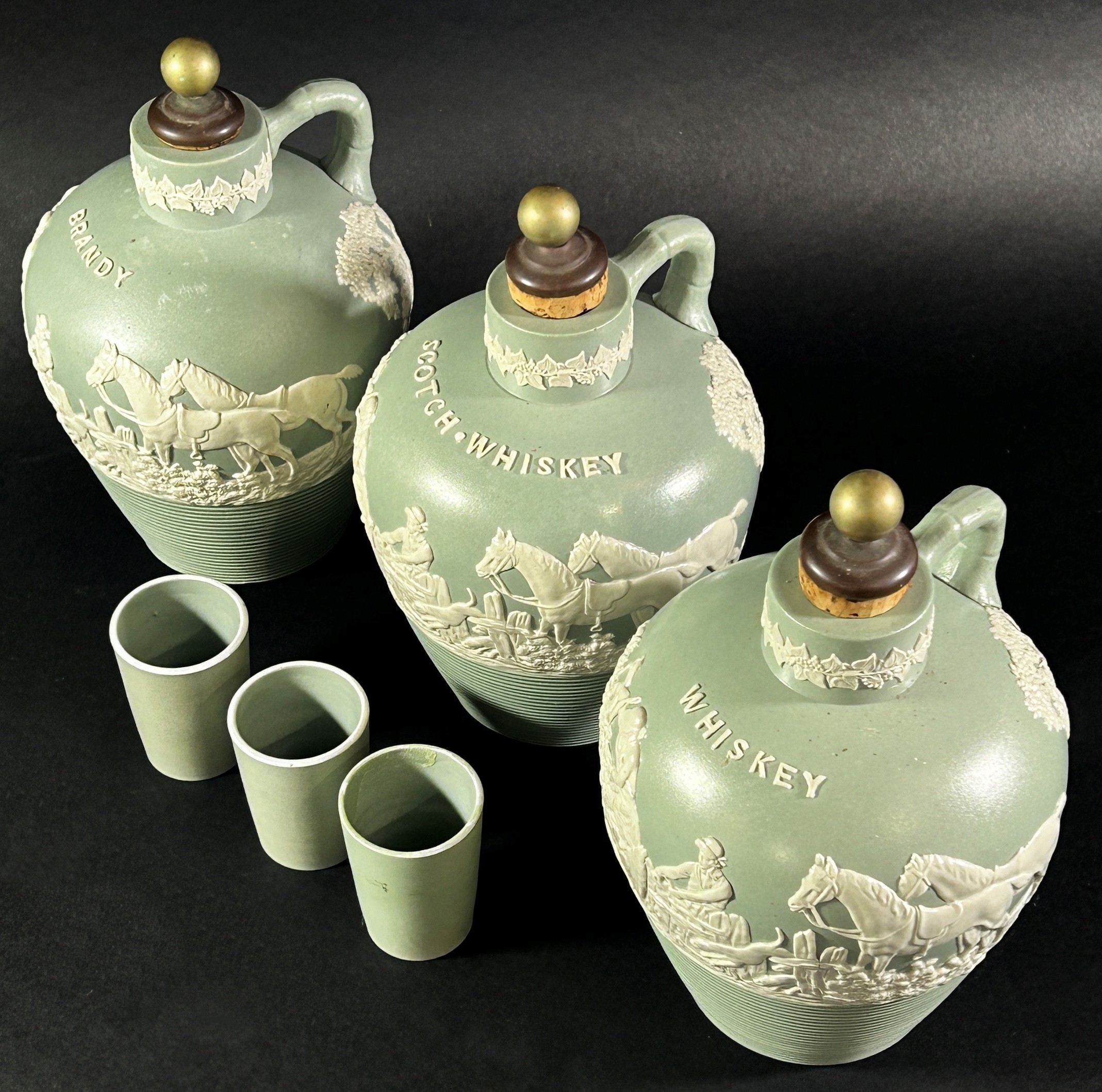 A late 19th century three bottle tantalus ceramics and silver plate frame, supporting three - Image 3 of 3