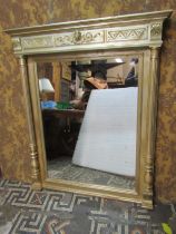 An overmantle mirror with bevelled edge mirror plate, carved frame later painted finish, 138cm