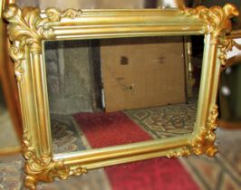 A contemplating rectangular gilt framed wall mirror with acanthus mounts 76 x 97cm