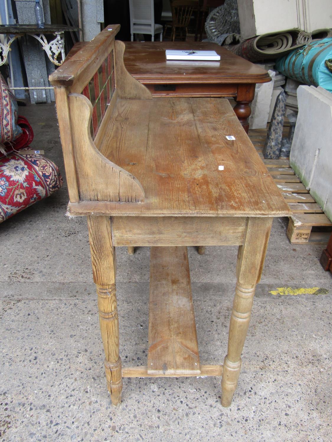 A Victorian stripped and waxed pine wash stand of simple form with turned supports and tiled back - Image 2 of 2