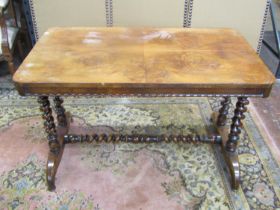 A mid-19th century mahogany centre table of rectangular form, the quarter panel top in a burr