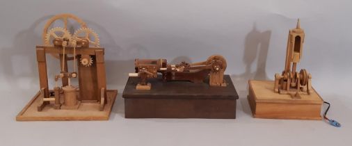 Three scratch-built wooden stationary steam engines models including a vertical engine with flywheel