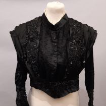 Late 19th century Victorian lady's bodice of black silk with long sleeves with pin-tucked cuffs, a