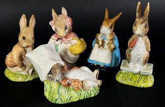 A collection of Royal Albert Beatrix Potter figures with brown back stamps, together with a Crown