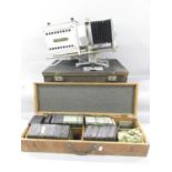 A 20th century Optiscope Magic lantern and a box of slides including Wales, England, Italy