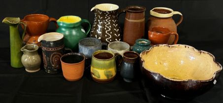 A quantity of studio pottery jugs and bowls to include Penrith slipware, further monogrammed