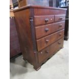 A substantial Victorian oak bedroom chest of three long and two short drawers beneath a well