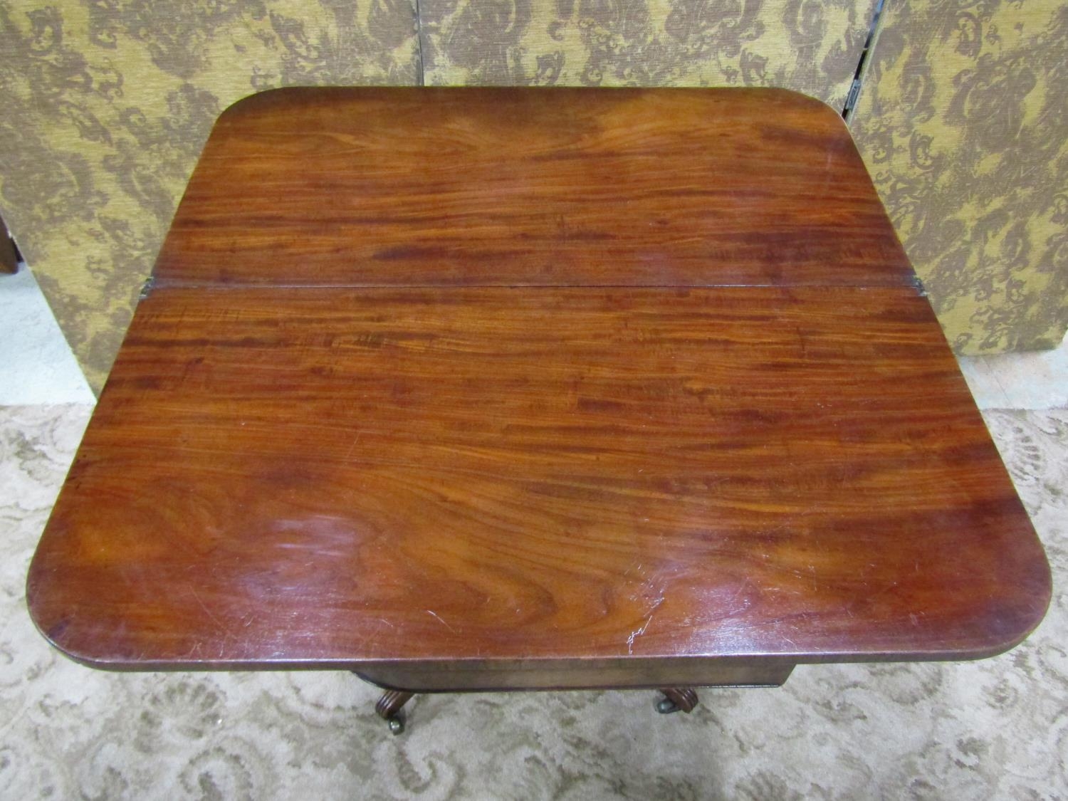 An early 19th century mahogany fold over top tea table of rectangular form with rounded corners, - Image 4 of 4