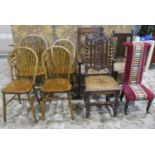 A set of four (3&1) Windsor stained beechwood wheelback dining chairs together with two rush