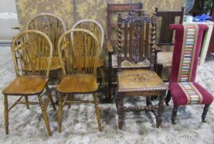 A set of four (3&1) Windsor stained beechwood wheelback dining chairs together with two rush