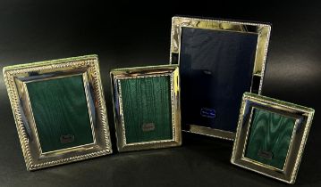 Three Harrods sterling silver rectangular photo frames with Harrods green silk backing, together