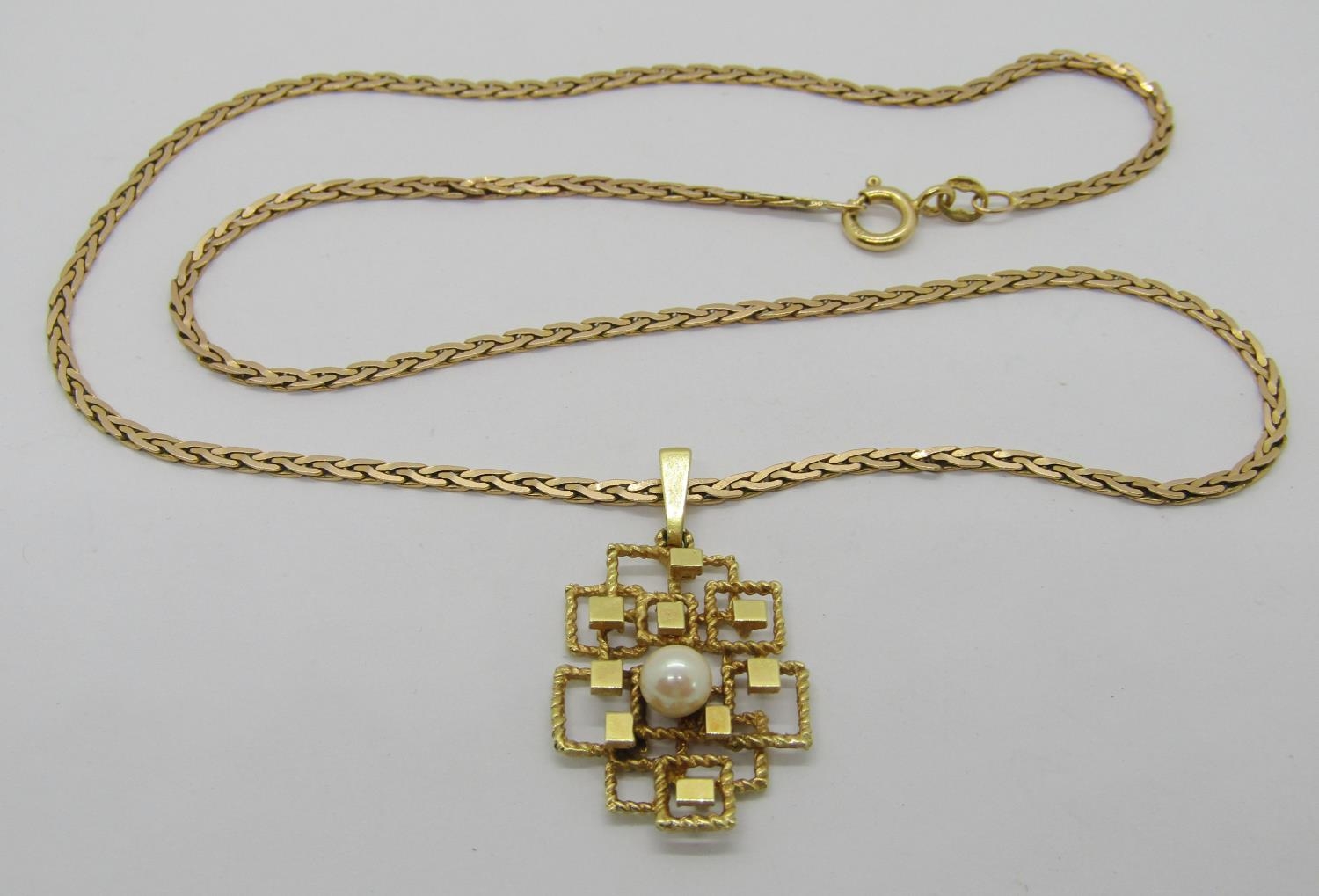 Vintage 14ct pendant set with a single pearl, hung from an associated 9ct chain necklace, 9.7g total