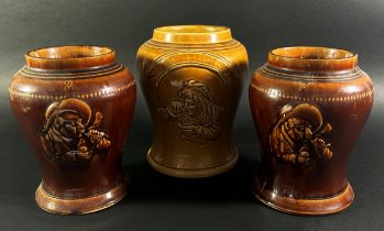 A collection of three salt glazed snuff jars with character detail