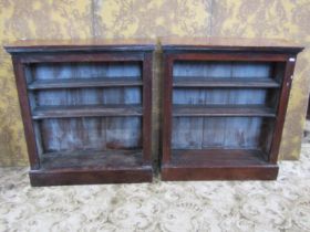 A pair of dwarf mahogany floor standing open bookcases each with two adjustable shelves, 84 cm