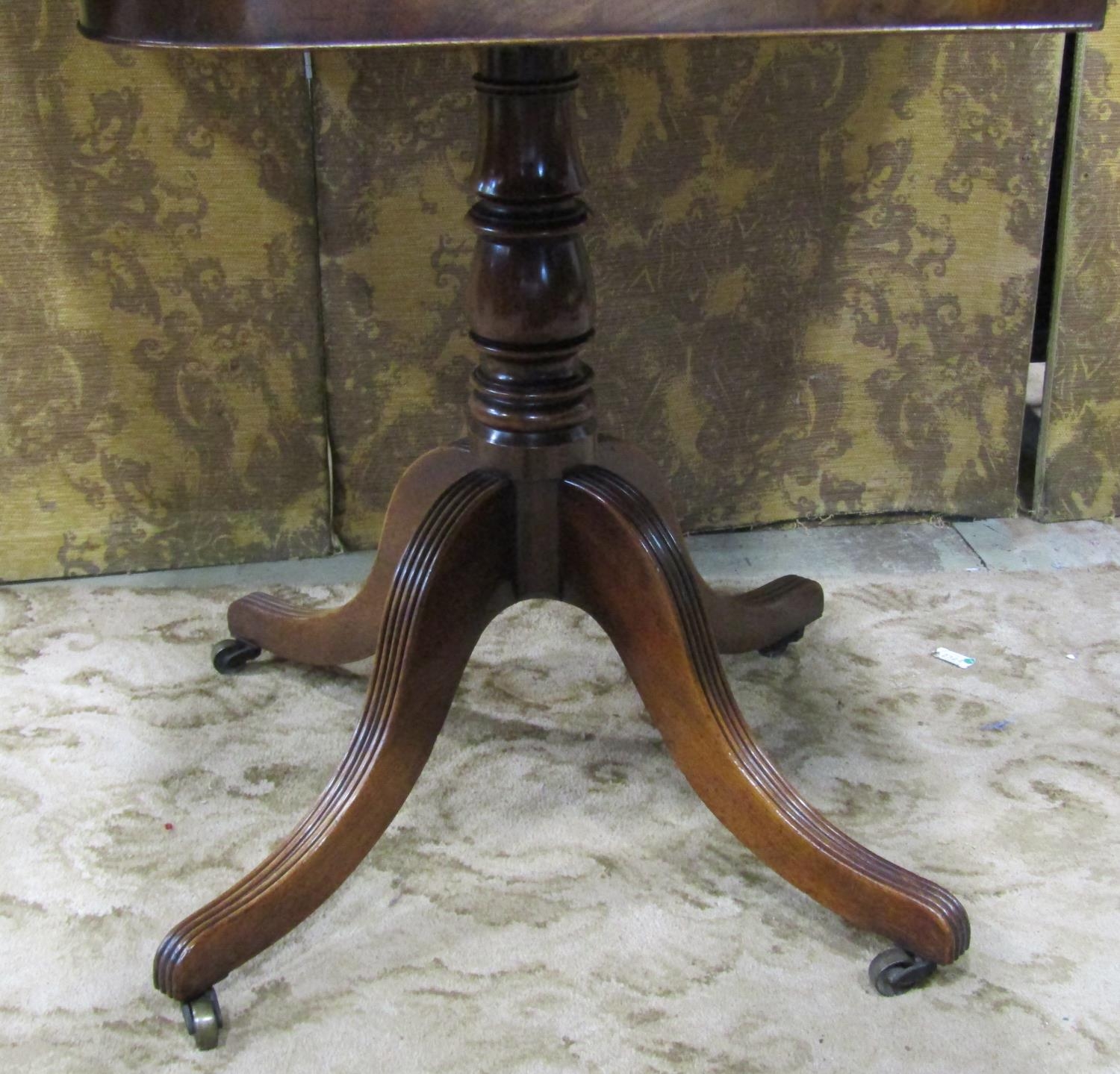 An early 19th century mahogany fold over top tea table of rectangular form with rounded corners, - Image 3 of 4