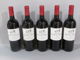Five bottles of Chateau Grand Tayac Margaux 2006, in an open wooden case.