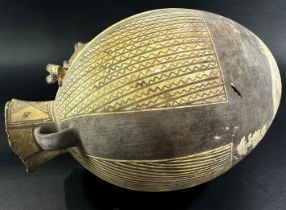 A large (possibly) pre-Colombian terracotta effigy vessel, of ovoid form with twin handles, with