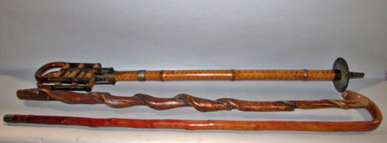 An early 20th century sturdy metal and bamboo shooting stick, stamped B TE SGDG to the hinge, carved
