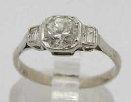 Art Deco 18ct white gold three stone diamond ring, centre stone 0.65ct approx, flanked by a pair