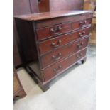 A Georgian mahogany bedroom chest of two short over three long graduated drawers set on bracket